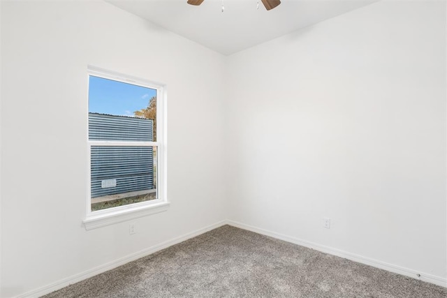 carpeted empty room featuring ceiling fan and a healthy amount of sunlight