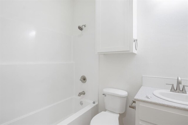 full bathroom with shower / tub combination, vanity, and toilet