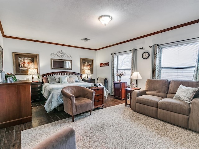 bedroom with crown molding, dark hardwood / wood-style flooring, and a textured ceiling