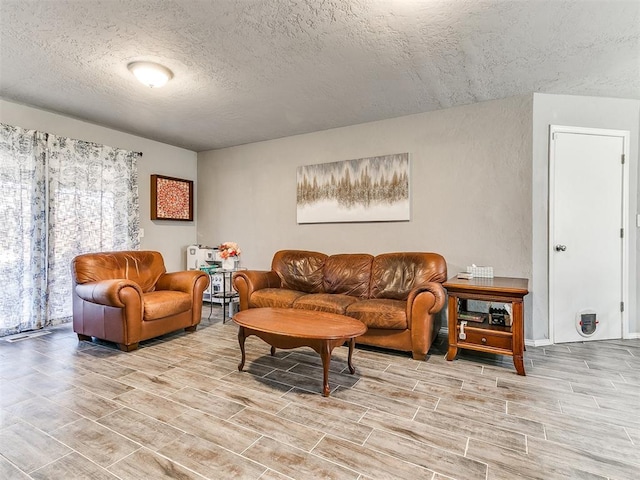 living room featuring a textured ceiling