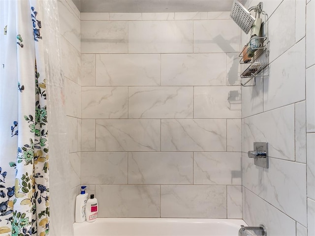 bathroom with shower / bath combo