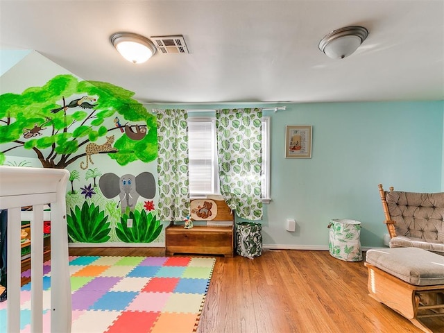 bedroom with hardwood / wood-style flooring