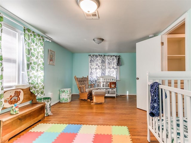 bedroom with wood-type flooring