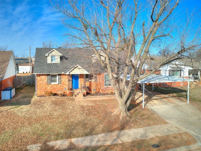 view of front facade featuring a carport and central air condition unit