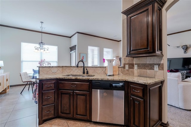 kitchen with sink, decorative backsplash, dark brown cabinets, and stainless steel dishwasher