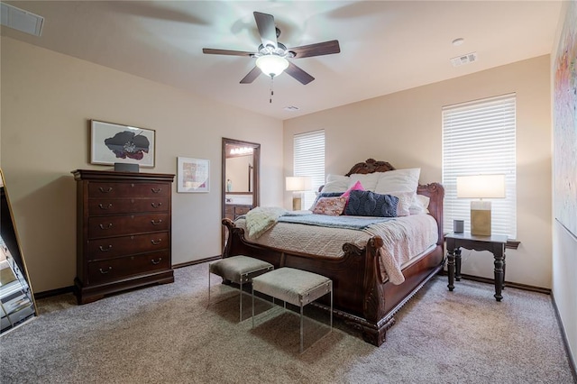 bedroom with ceiling fan and light colored carpet