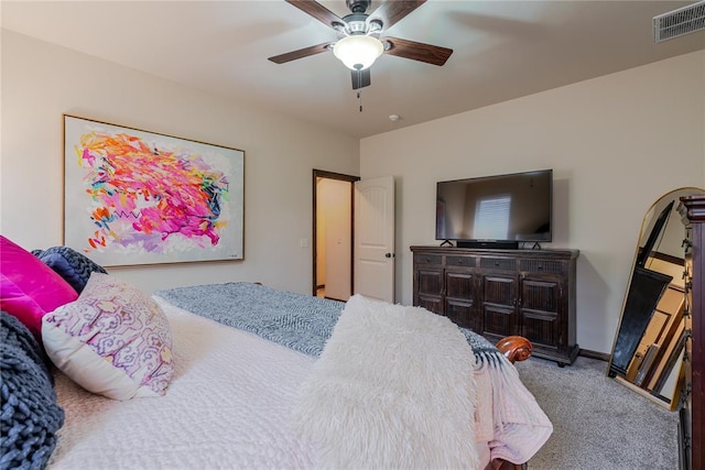 bedroom featuring ceiling fan and carpet