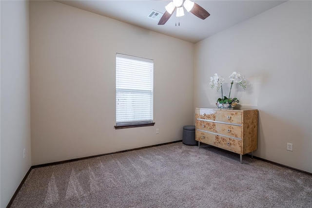 interior space with ceiling fan and carpet floors