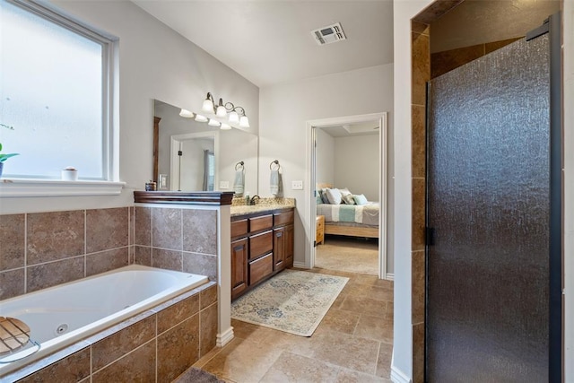 bathroom with vanity and plus walk in shower