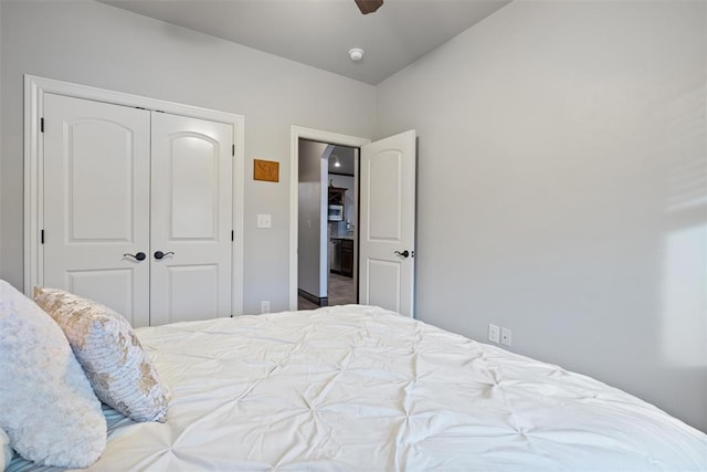 bedroom featuring ceiling fan and a closet