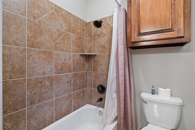 bathroom featuring shower / bath combo and toilet