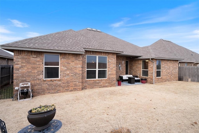 rear view of house with an outdoor hangout area and a patio