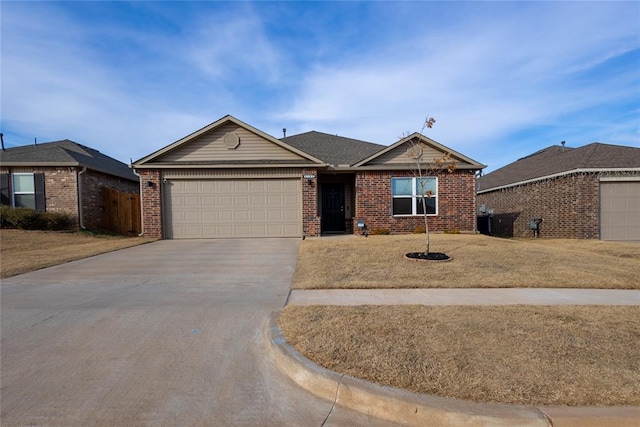 ranch-style home with a garage and a front yard