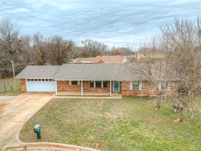 single story home with a garage and a front yard