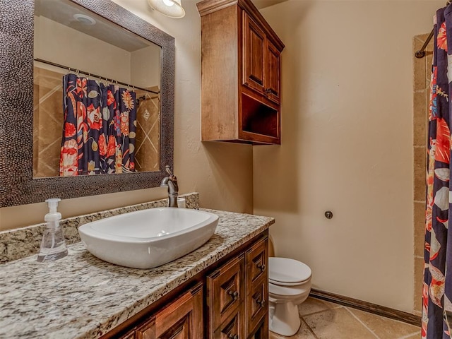 bathroom featuring vanity, a shower with shower curtain, and toilet