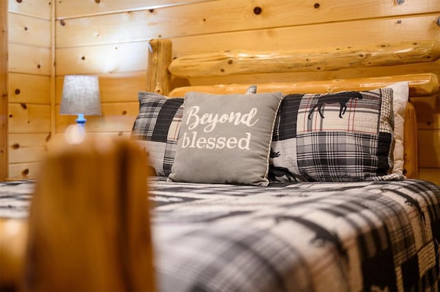 bedroom featuring rustic walls