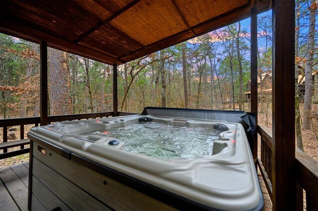 deck featuring a hot tub