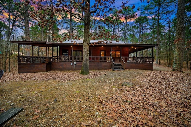 view of back house at dusk