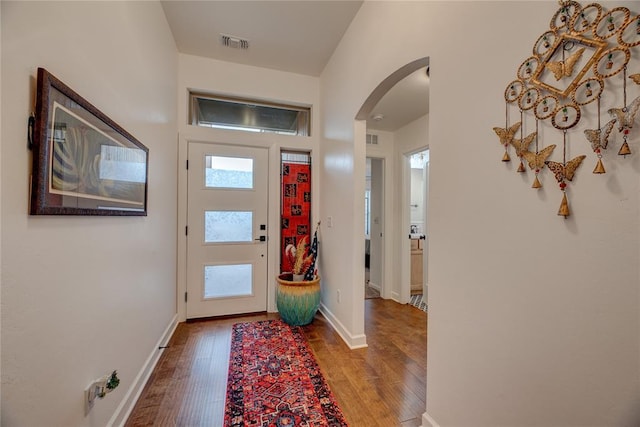 foyer entrance with hardwood / wood-style floors