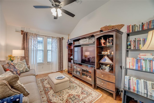 living room featuring lofted ceiling and ceiling fan