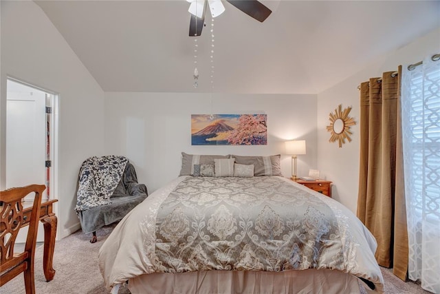 bedroom featuring ceiling fan, lofted ceiling, and light carpet