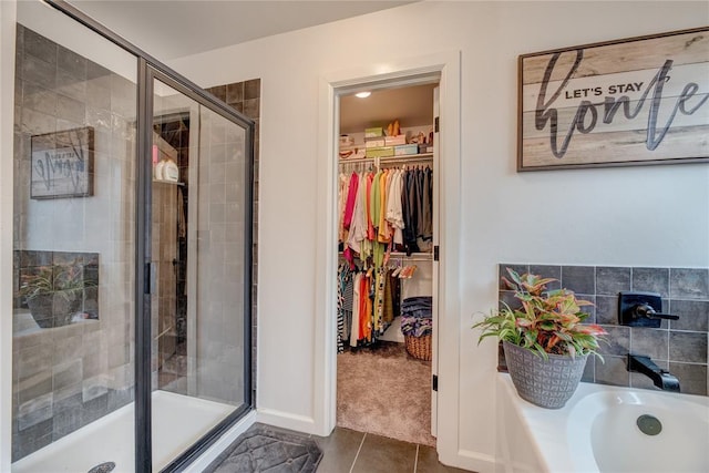 bathroom featuring tile patterned flooring and a shower with door