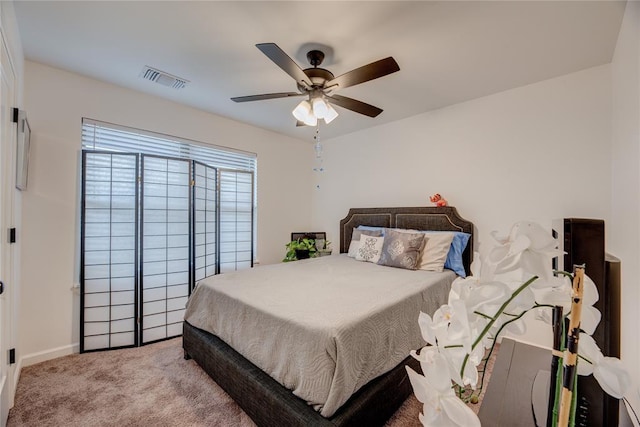 carpeted bedroom with ceiling fan