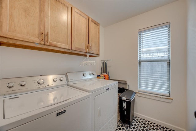 laundry area with cabinets and washing machine and clothes dryer