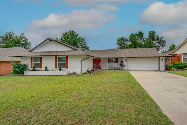 single story home featuring a garage and a front lawn