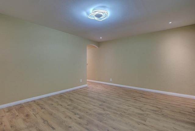 spare room featuring light hardwood / wood-style flooring