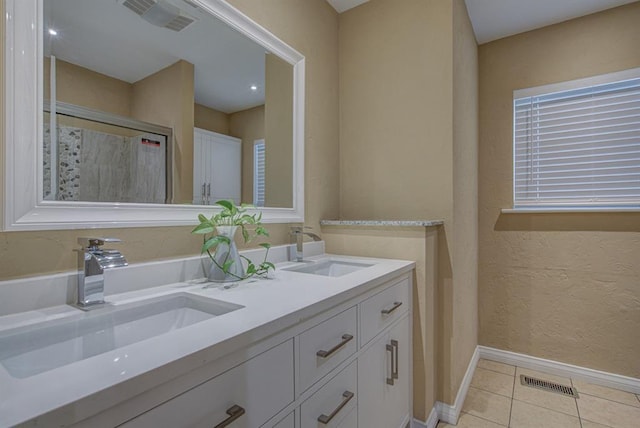 bathroom featuring tile patterned floors and vanity