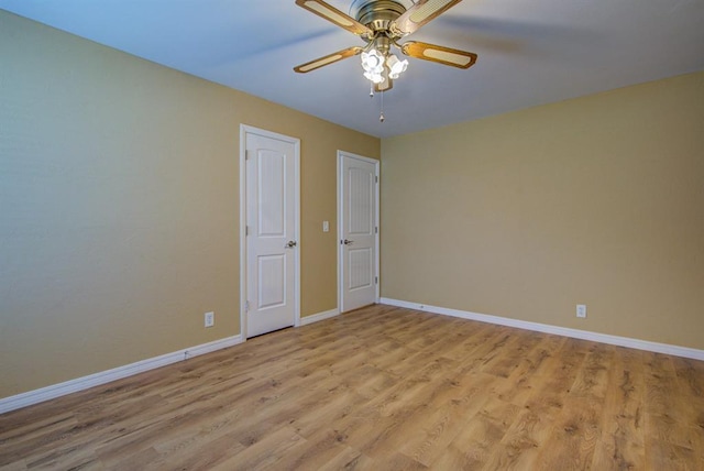 unfurnished room with light hardwood / wood-style floors and ceiling fan