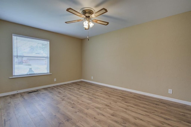 unfurnished room featuring ceiling fan and light wood-type flooring