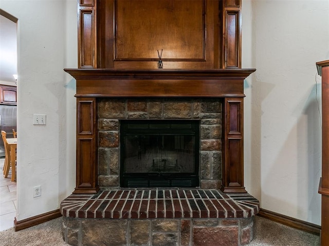 interior details with refrigerator and carpet floors