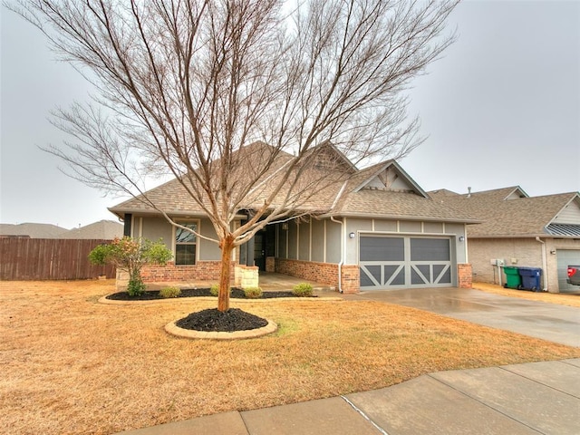 view of front of home with a garage and a front yard