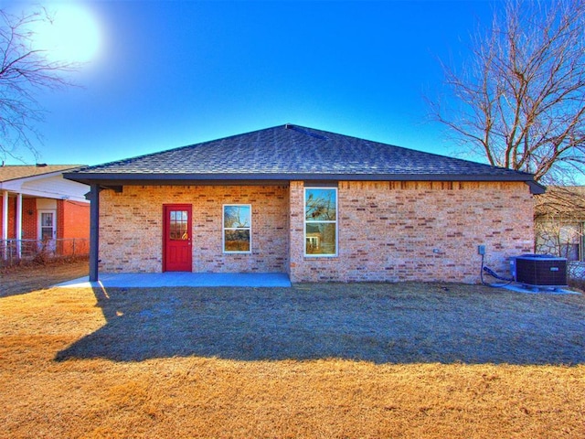 rear view of property with a patio and central AC unit