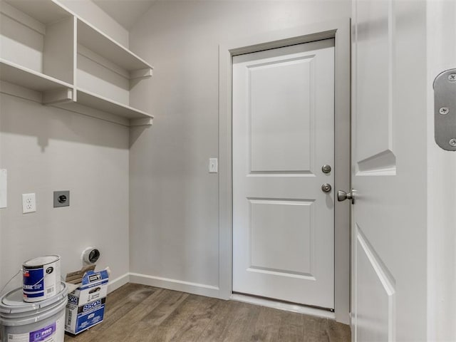 laundry room featuring hardwood / wood-style flooring and hookup for an electric dryer