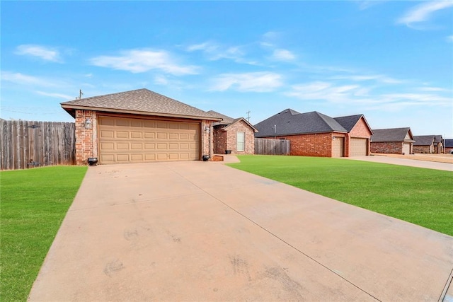 ranch-style home with a garage and a front lawn