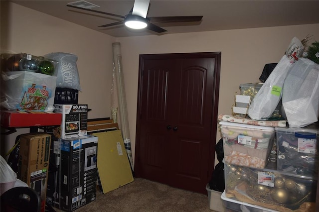 carpeted office with ceiling fan