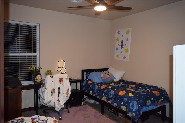 carpeted bedroom with ceiling fan