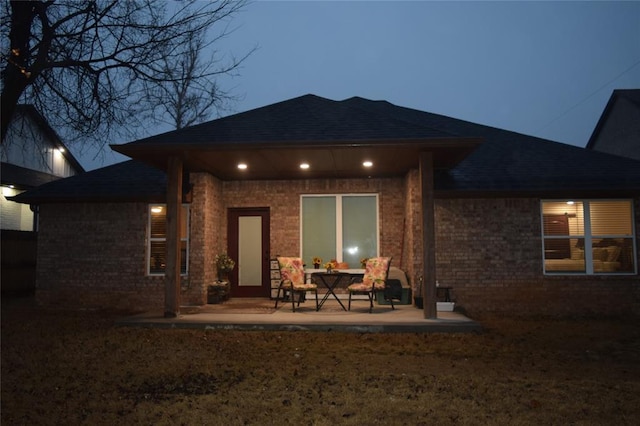 rear view of property featuring a patio