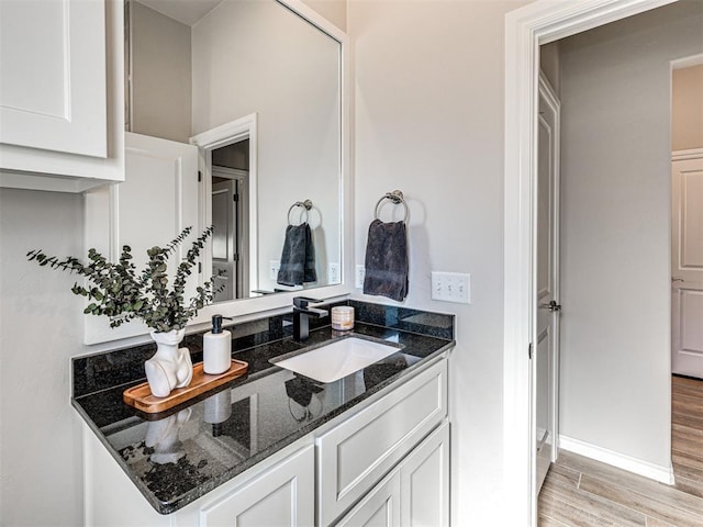 bathroom featuring vanity and hardwood / wood-style floors