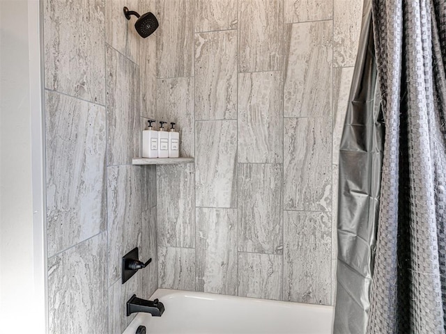 bathroom with shower / tub combo with curtain