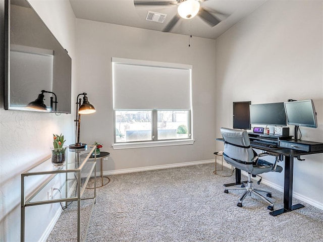 carpeted office featuring ceiling fan