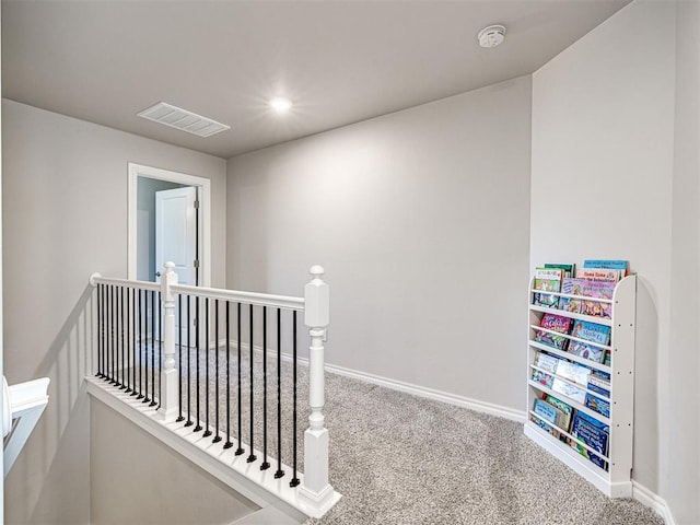 hallway with carpet flooring