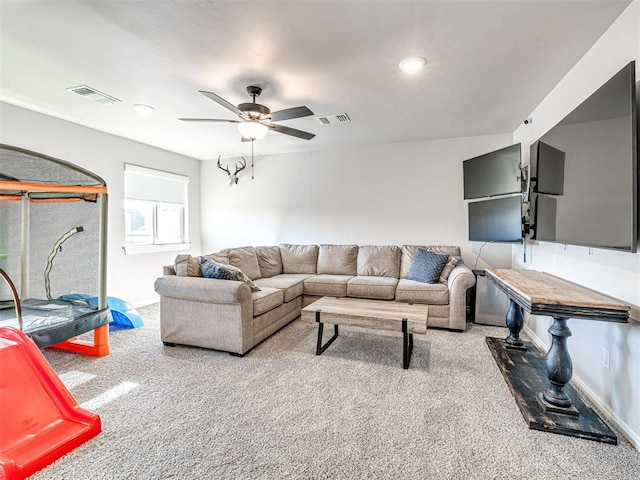 living room featuring carpet floors and ceiling fan