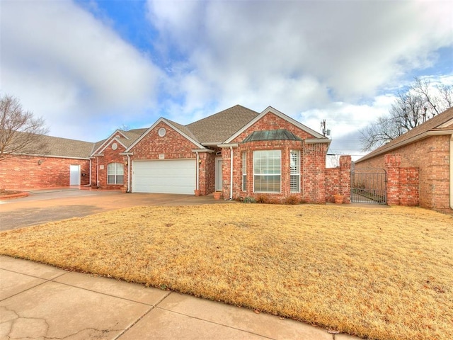 view of front of property featuring a garage and a front yard