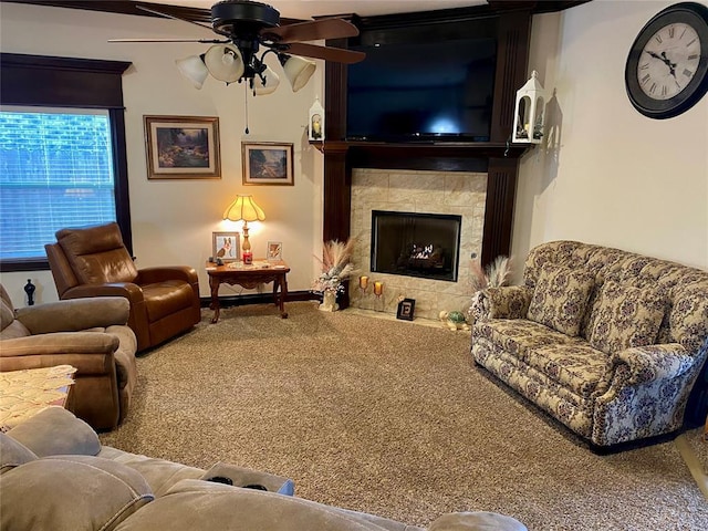 living room with ceiling fan, a fireplace, and carpet