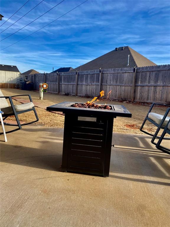 view of patio / terrace with an outdoor fire pit