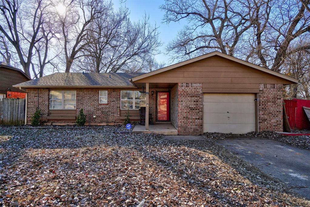 ranch-style home with a garage